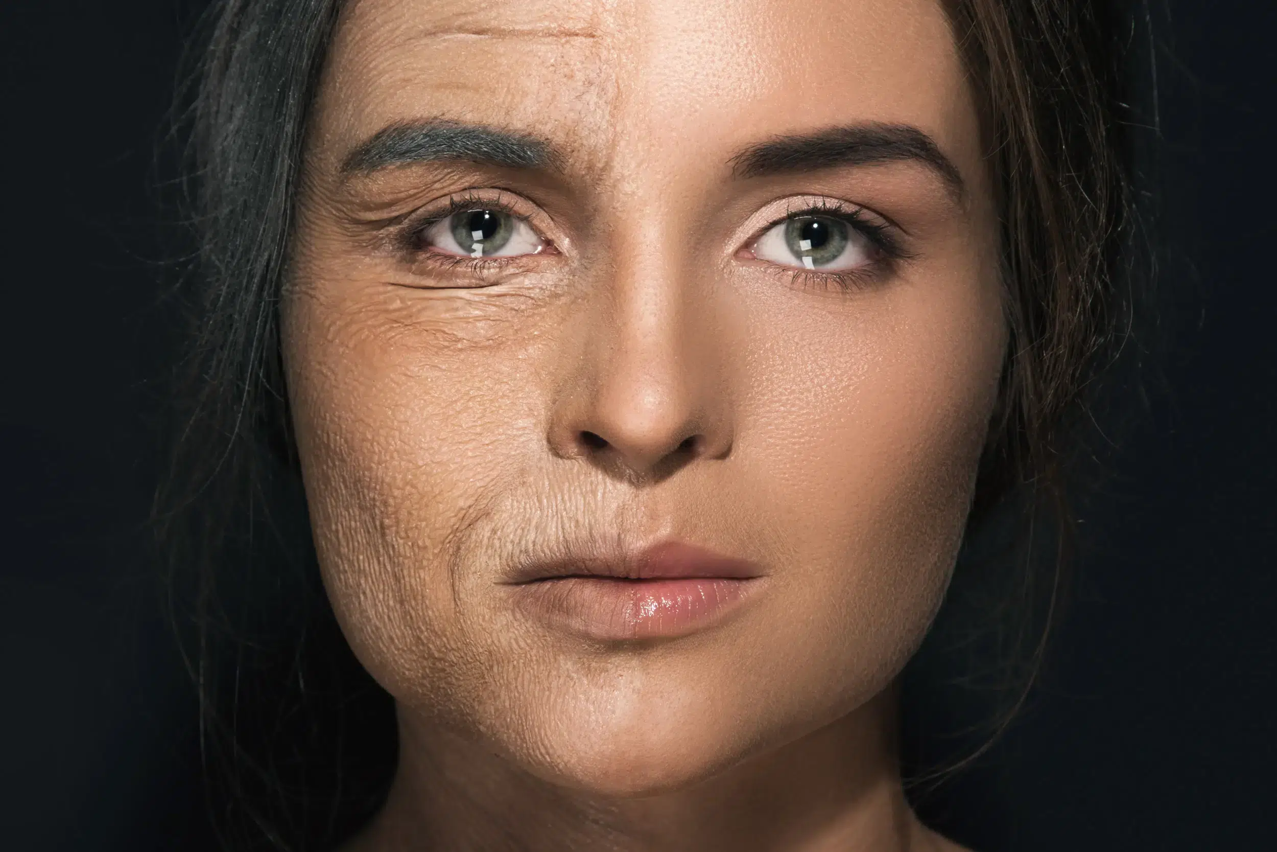 Split-face comparison showing one side with visible signs of facial aging — including fine lines, wrinkles, and loss of skin elasticity — next to a smoother, more youthful-looking side on the same woman.